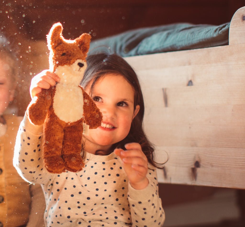 Girl holding Senger baby fox