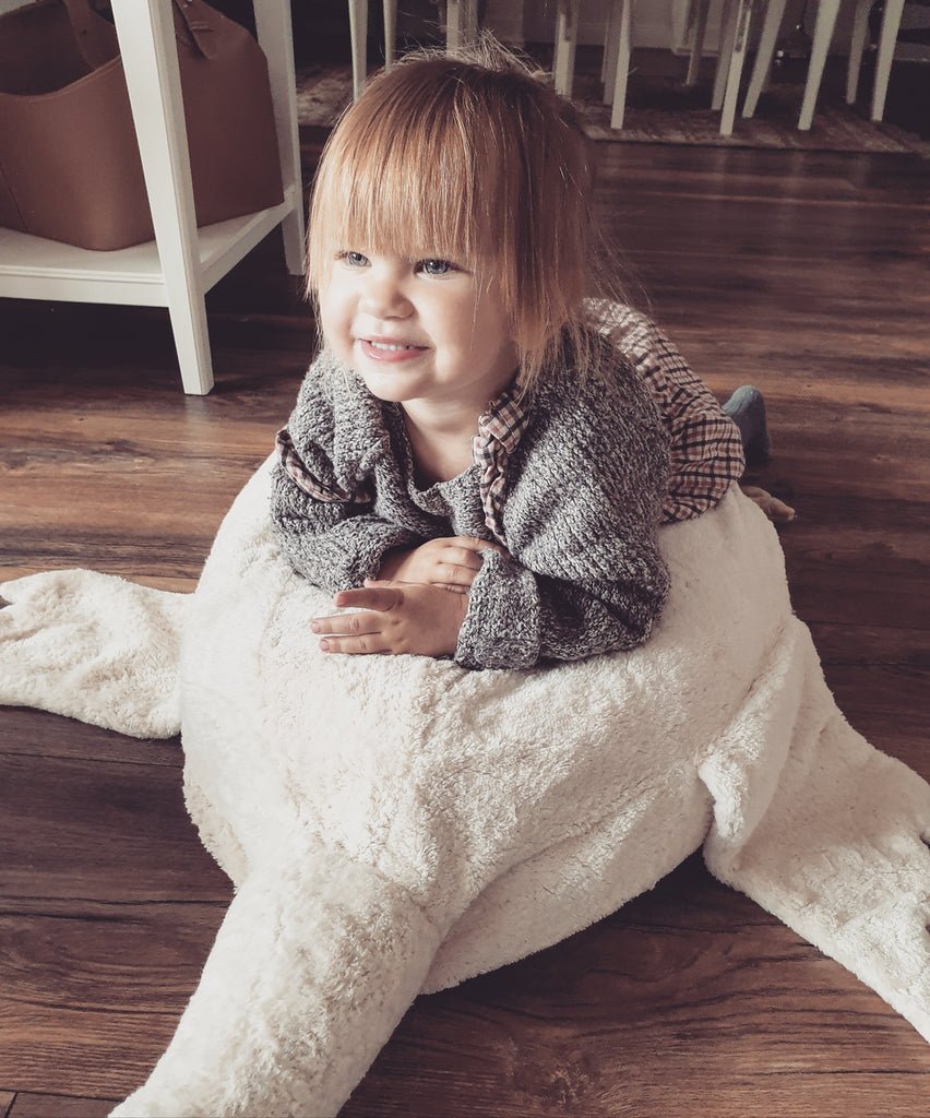 child playing on senger beanbag goose